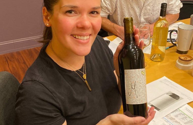 maria with wine bottle designed